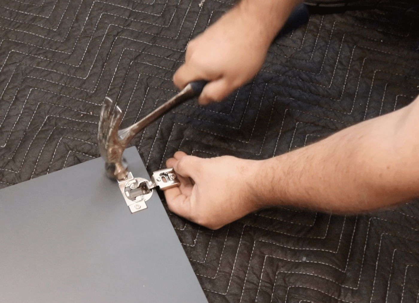 Tapping a hinge into a new cabinet door