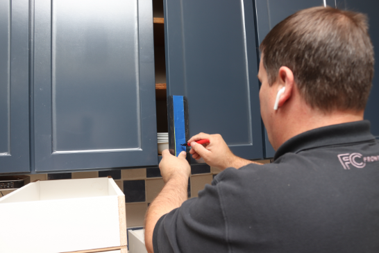 Installing a pull on a cabinet door