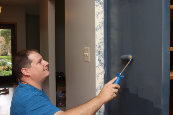 Rolling the first coat of paint
