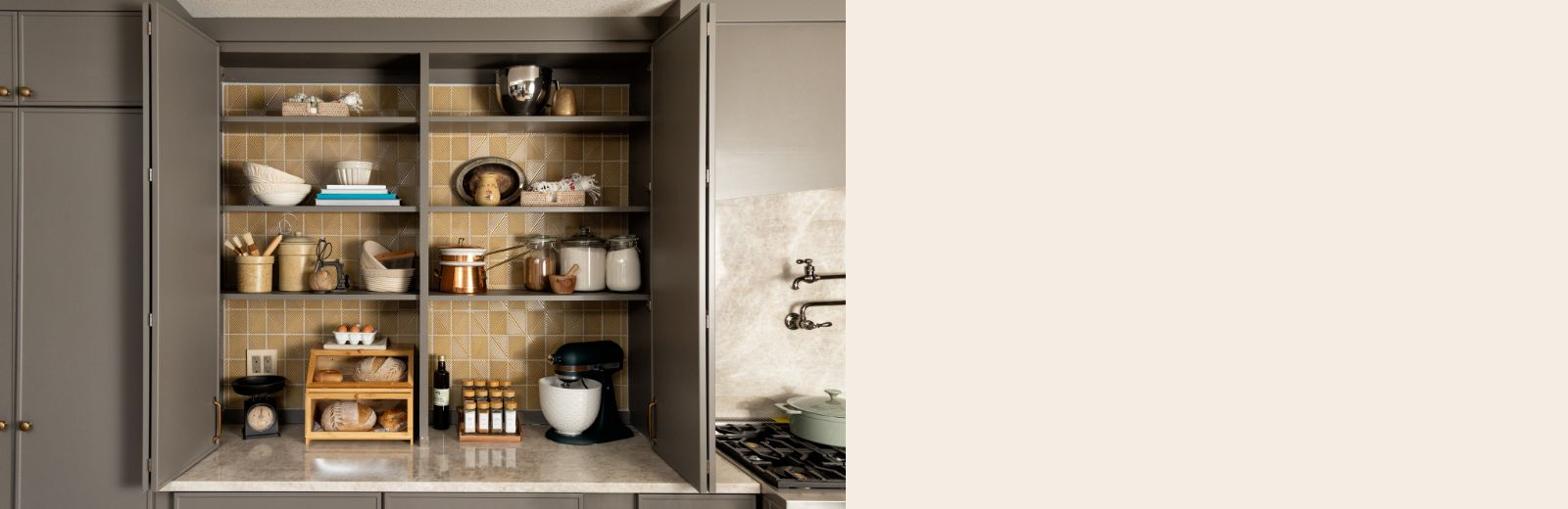 Open cabinet doors showing pantry shelves
