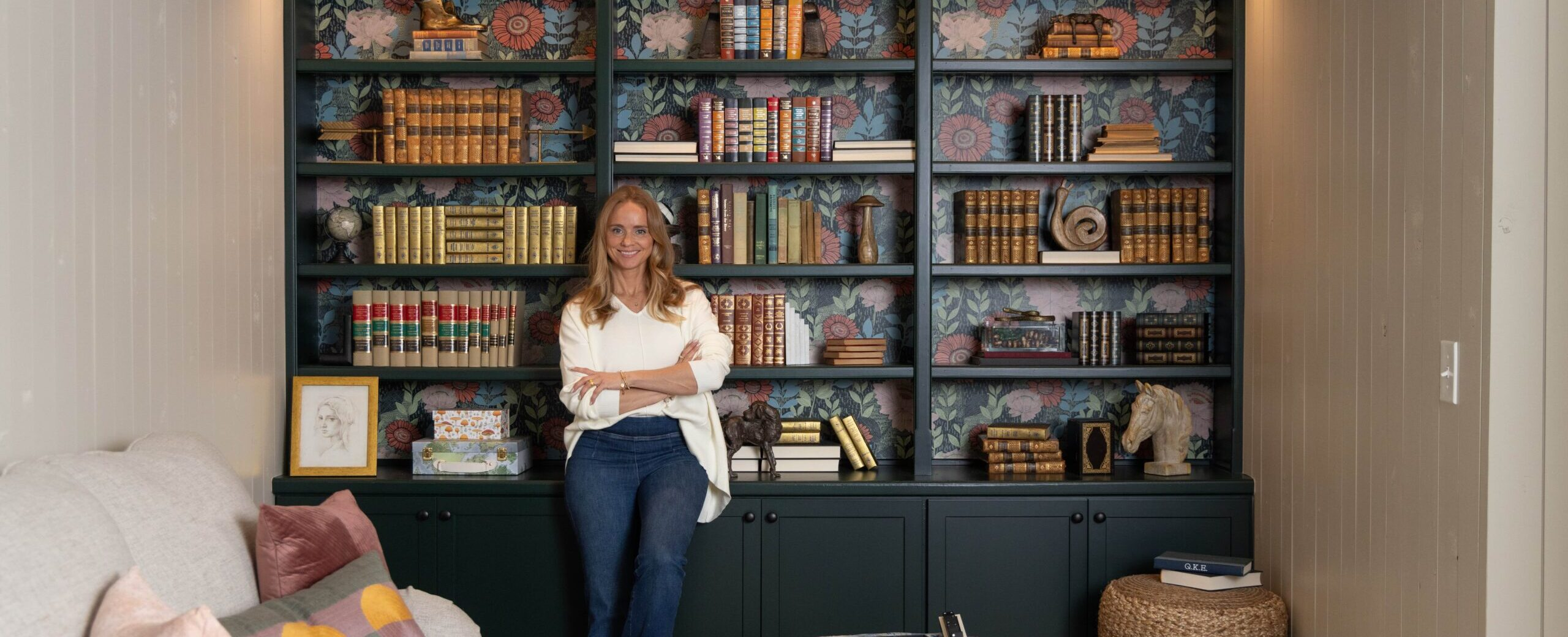 Tamara Day in front of refaced built-in bookshelves