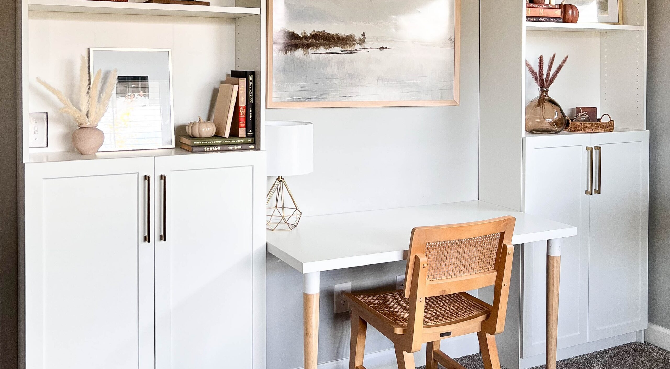 A bookshelf beside cabinets in the Salt Shaker finish