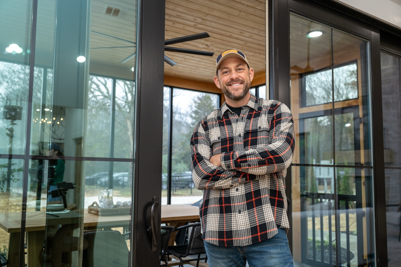 Dave Marrs standing in a renovated home